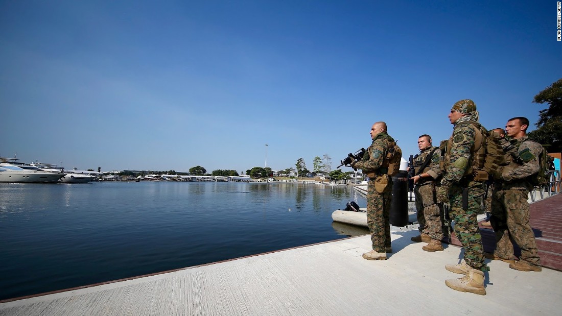 Members of Brazil&#39;s military police at the marina which will be home to Olympic sailing events. Water pollution at this venue and security concerns are just two of the issues Rio organizers face.