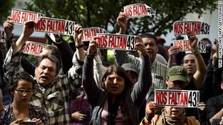 Parents and other relatives of the 43 missing students from the Ayotzinapa's teachers school attend the reading of the final report from the Interdisciplinary Group of Independent Experts (GIEI) in Mexico City on April, 24, 2016. / AFP / YURI CORTEZ        (Photo credit should read YURI CORTEZ/AFP/Getty Images)