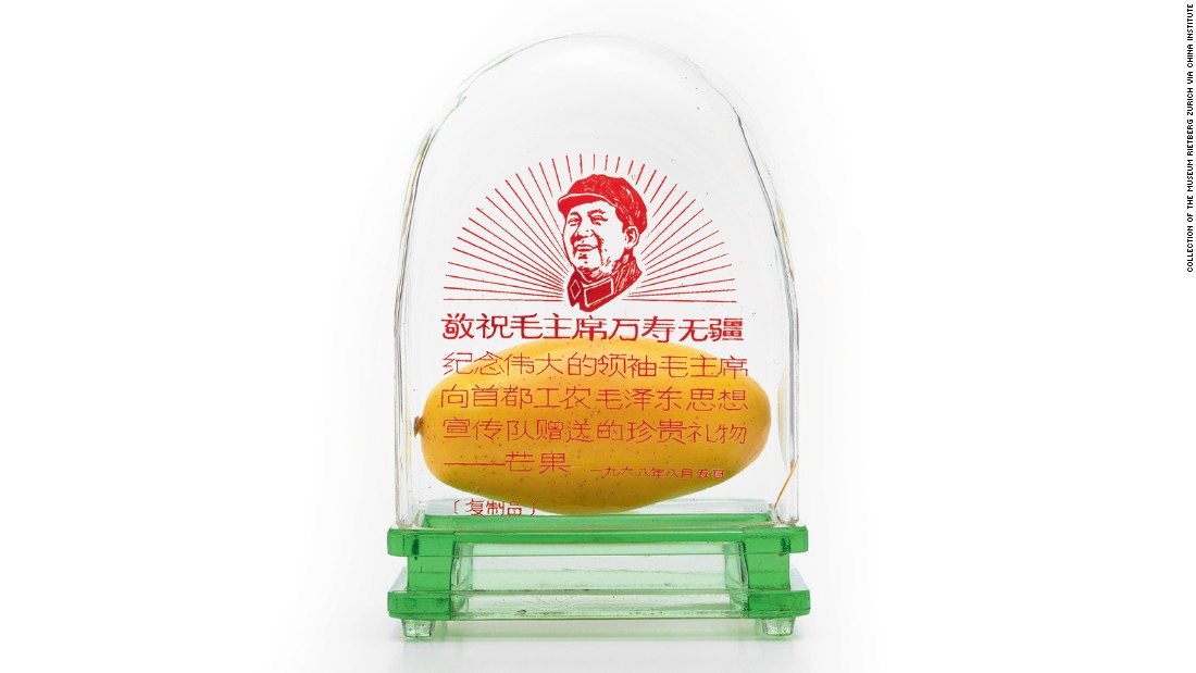 The political message of the gift was clear: workers, not students, would be in charge of the Cultural Revolution. The symbol was quickly adopted and mangoes were bused into provincial towns and exhibited in public. Display cases, like this one, were given to workers as merit awards. 