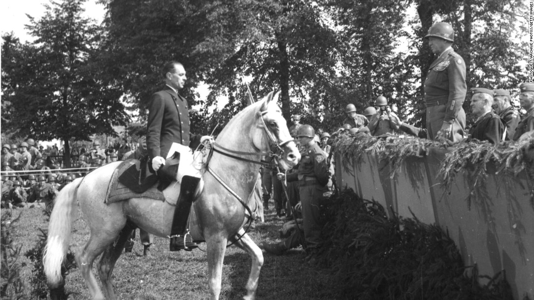 Austrian Colonel Alois Podhajsky, director of the Spanish Riding School from which many of the horses were captured and taken to Hostau, performs for General Patton.