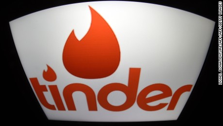 A picture shows the logo of dating app Tinder on a tablet in Paris on March 15, 2016. / AFP / LIONEL BONAVENTURE        (Photo credit should read LIONEL BONAVENTURE/AFP/Getty Images)