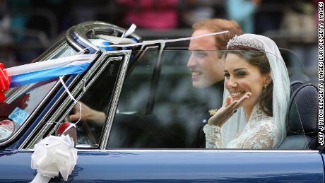 Prince William and Catherine, Duchess of Cambridge drive from Buckingham Palace in a decorated sports car on April 29, 2011 in London, England. 