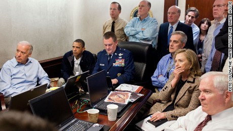 President Barack Obama and Vice President Joe Biden, along with members of the national security team, receive an update on the mission against Osama bin Laden in the Situation Room of the White House, May 1, 2011. 