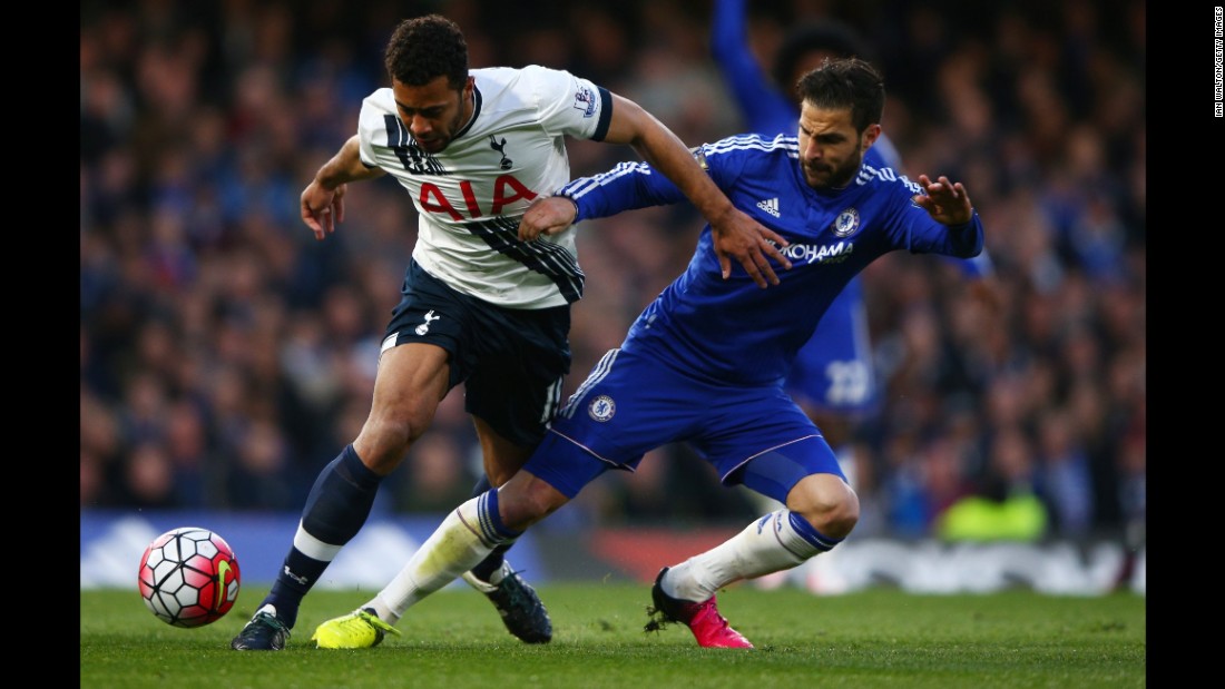 Tottenham&#39;s Mousa Dembele, left, is tackled by Chelsea&#39;s Cesc Fabregas during the match in London.