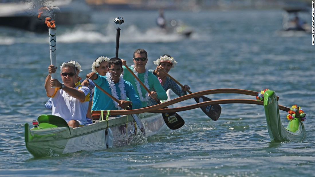 Canoeist Rubens Pompeu carried the Olympic flame on an outrigger canoe at Lake Paranoa. The torch will be carried in a relay by 12,000 people throughout its journey across the country.&lt;br /&gt;