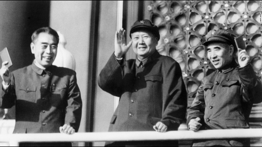 China&#39;s leaders during the Cultural Revolution: Premier Zhou Enlai, Chairman Mao Zedong and Defense Minister Lin Biao wave during a military parade on Tiananmen Square. 
