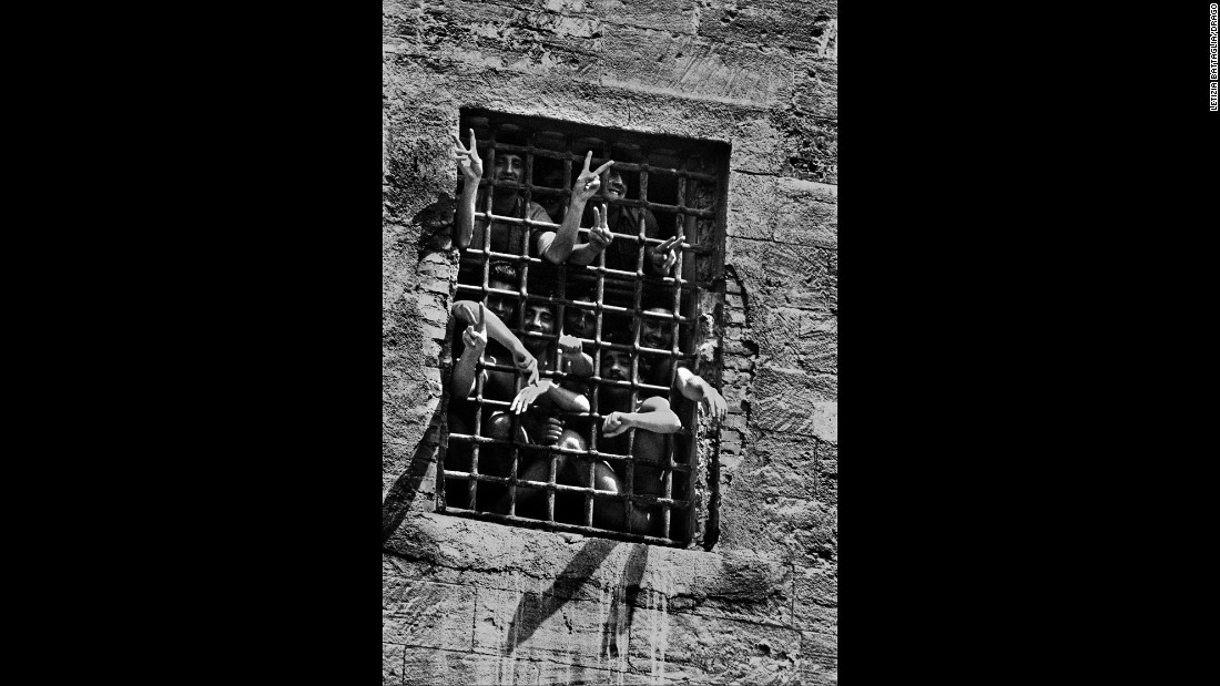 Prisoners are seen behind bars in Palermo in 1983.