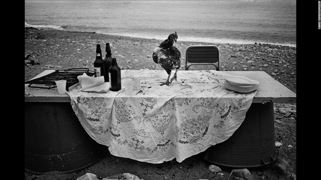 The picture from 1986 is one of Battaglia&#39;s favorites. &quot;I went to the seaside to shoot something, and I saw this very strange table. Someone had organized a party on the seaside and I don&#39;t know why, but all that was left was this hen. It&#39;s poetic. I am looking for poetry in life. That&#39;s all I need.&quot;