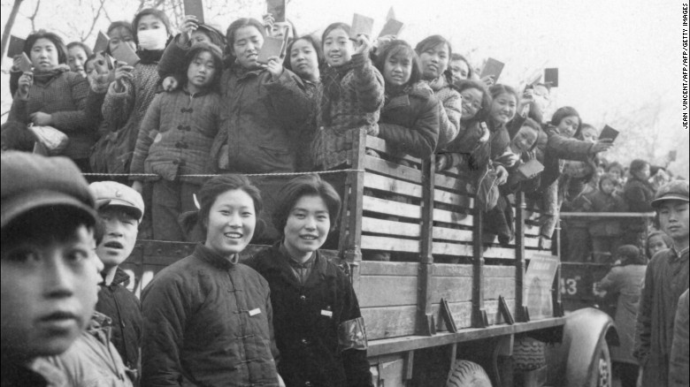 The Red Guards, high school and university students, brandishing the copies of Chairman Mao Zedong&#39;s &quot;Little Red Book&quot; in Beijing in 1966.