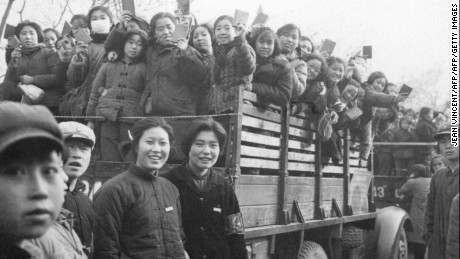 The Red Guards, high school and university students, brandishing the copies of Chairman Mao Zedong&#39;s &quot;Little Red Book&quot; in Beijing in 1966.