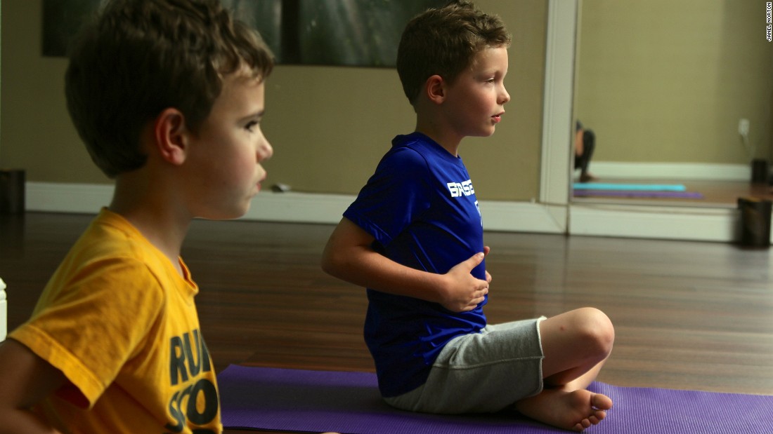 The boys work on their breathing technique. &quot;Rib riding&quot; reinforces proper breathing biomechanics.