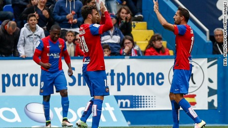 Levante&#39;s Victor Casadesus (center) celebrate after scoring against Atletico Madrid.