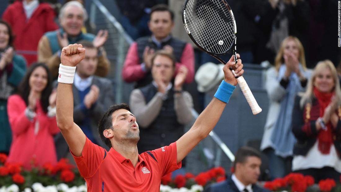 Novak Djokovic celebrates beating Andy Murray in the final of the 2016 Madrid Open.