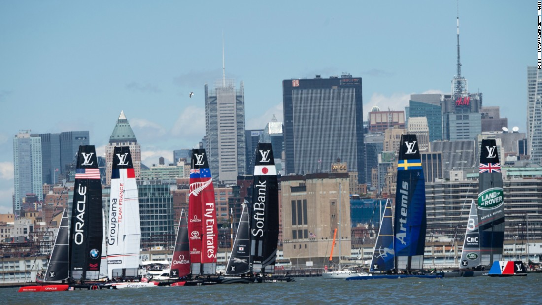Sailboats maneuver for position during the start of the first race on Sunday.