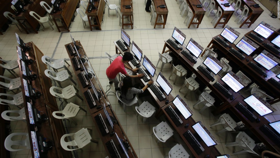 Workers check computers at the command center of the church-backed election watchdog Parish Pastoral Council for Responsible Voting (PPCRV) in Manila, Philippines on the eve of election day, Sunday, May 8, 2016. 