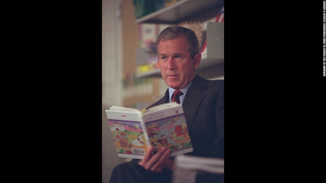 Bush listens to students read during the visit to Emma E. Booker Elementary School.