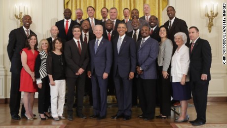 President Barack Obama and Vice President Joe Biden pose for photographs with members of the 1983 NCAA championship North Carolina State men&#39;s basketball team to the White House May 9. Obama honored the Wolfpack&#39;s historic win at the White House 33 years after their national victory. 