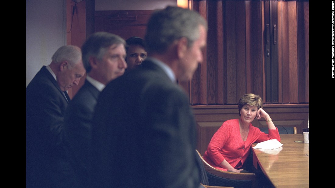 First lady Laura Bush listens as Bush discusses the terrorist attacks with White House staff in the President&#39;s Emergency Operations Center.