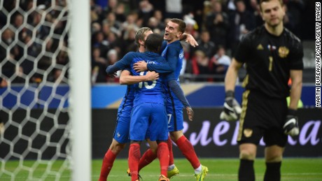 N&#39;Golo Kante (center) celebrates a debut France goal on his 25th birthday.
