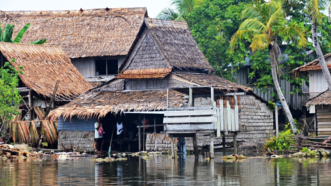 Communities in parts of the Solomon Islands have been forced to move to higher volcanic islands as they watch their coastline recede, pushing seawater into their homes. Photo taken October 2013.