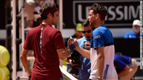 Roger Federer shakes hands with Dominic Thiem after his third-round loss at the Italian Open.