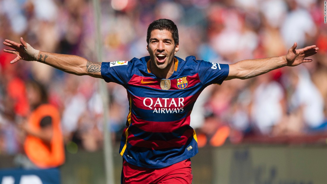 Suarez celebrates his crucial opener for Barcelona in the win at Granada which kept it a point clear of Real.  
