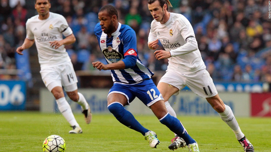 Deportivo&#39;s Sidney fights for the ball with Real Madrid&#39;s Gareth Bale, who was substituted before the end of the match with the Champions League final still to come for his side.  