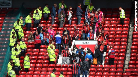 MANCHESTER, ENGLAND - MAY 15:  Fans are evacuated from the ground as the match is abandoned ahead of the Barclays Premier League match between Manchester United and AFC Bournemouth at Old Trafford on May 15, 2016 in Manchester, England.  (Photo by Alex Livesey/Getty Images)