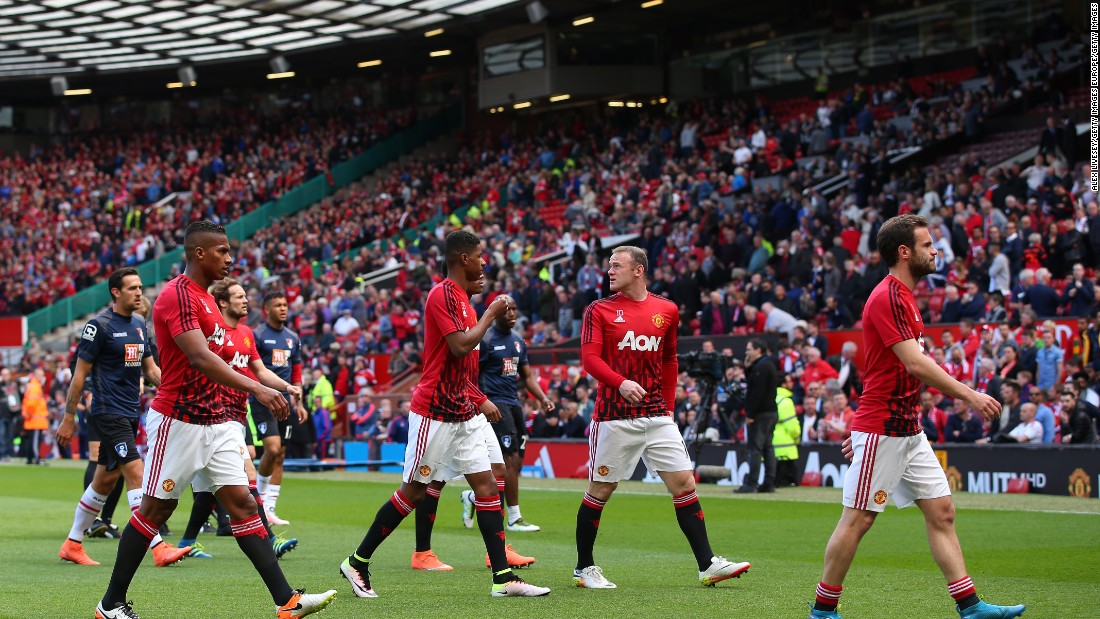 The Manchester United players, including Wayne Rooney, leave the field after warming up for what would have been their final game of the English Premier League season.