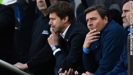 Mauricio Pochettino cuts a folorn figure on the Spurs bench as he watches his side lose 5-1.