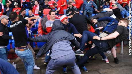 Fans scuffle prior to the UEFA Europa League Final match between Liverpool and Sevilla at St. Jakob-Park.
