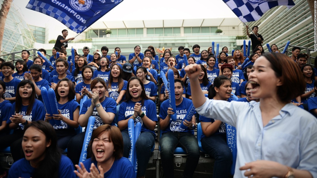 Leicester fans run through a cheerleading routine as they prepare to welcome the victorious Foxes players and staff to the city. Some of Bangkok&#39;s major roads were closed to traffic for the parade, which centered on Sukhumvit Road, a street that crosses the city.