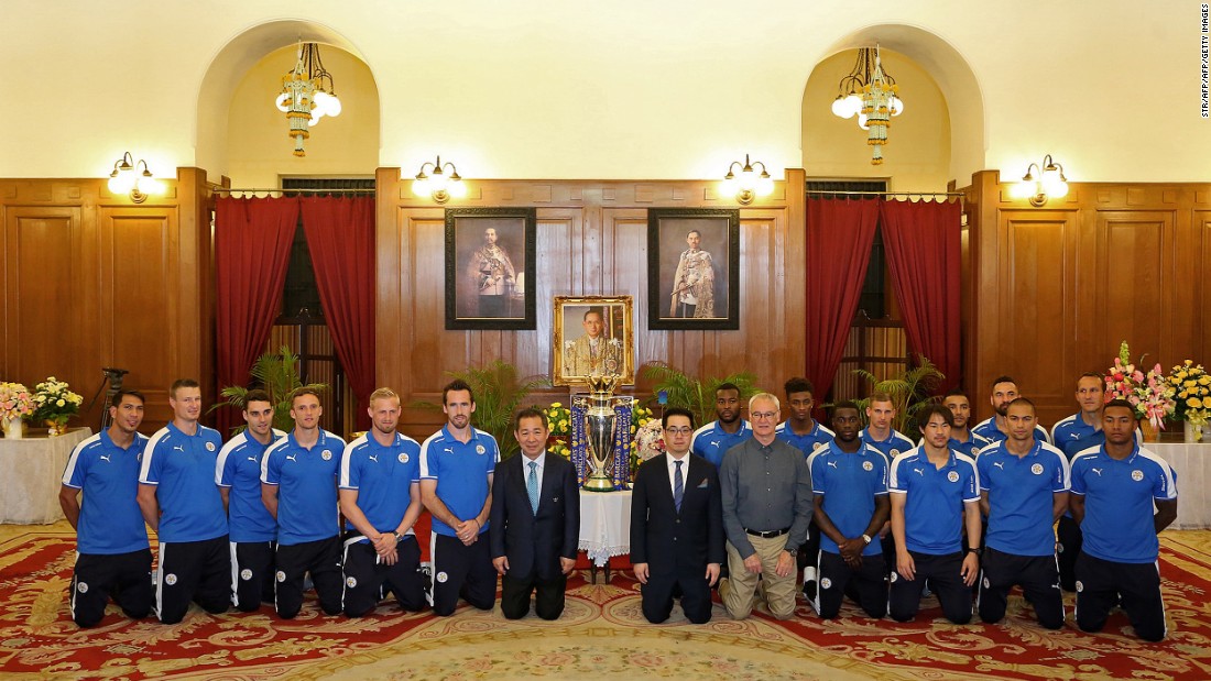 Before the parade, Ranieri, Vichai Srivaddhanaprabha (first row, seventh left) and his son, Leicester vice-chairman Aiyawatt &quot;Top&quot; Srivaddhanaprabha (first row, sixth right), joined the players to kneel and pay their respects to a picture of Thai King Bhumibol Adulyadej, the world&#39;s longest-serving monarch, as they received a royal seal of approval at Bangkok&#39;s Grand Palace. Aiyawatt said the players were &quot;massive in Thailand now.&quot;