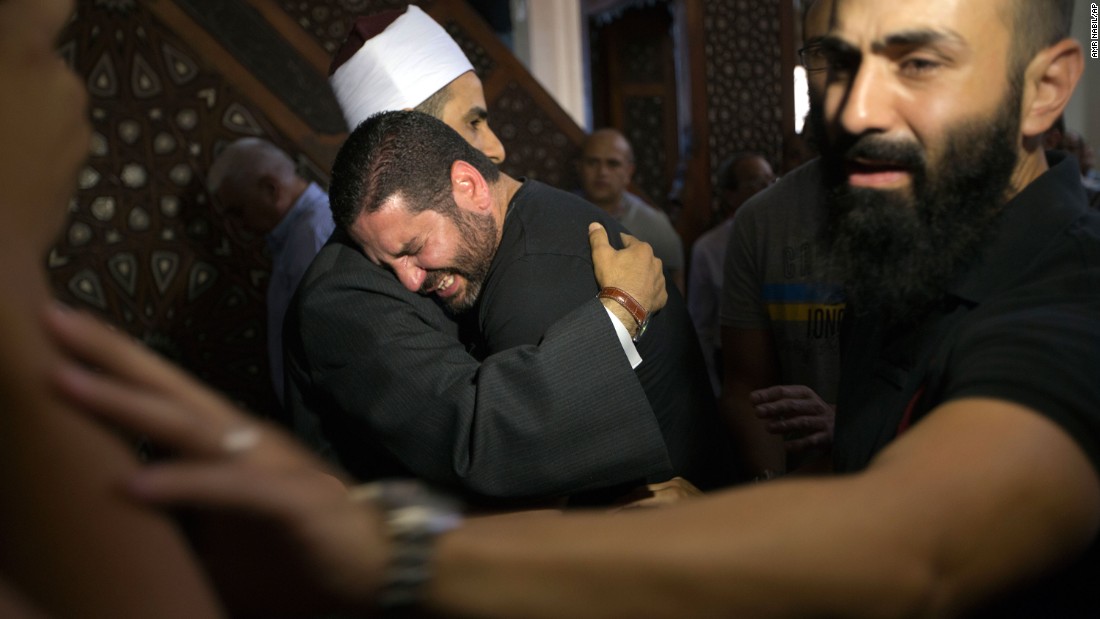 Samir Abdel Bary, imam of Cairo&#39;s al Thawrah Mosque, consoles Tarek Abu Laban, who had four relatives on the flight, on Friday, May 20. 