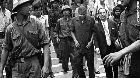 Former Vietnam President Duong Van Minh (C, looking down), leaving the presidential palace in Saigon 30 April 1975.