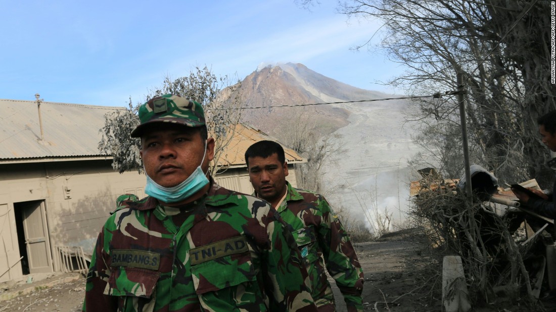 Indonesian soldiers conduct search and rescue operations Sunday, May 22 in a North Sumatra village after the volcano eruption. 