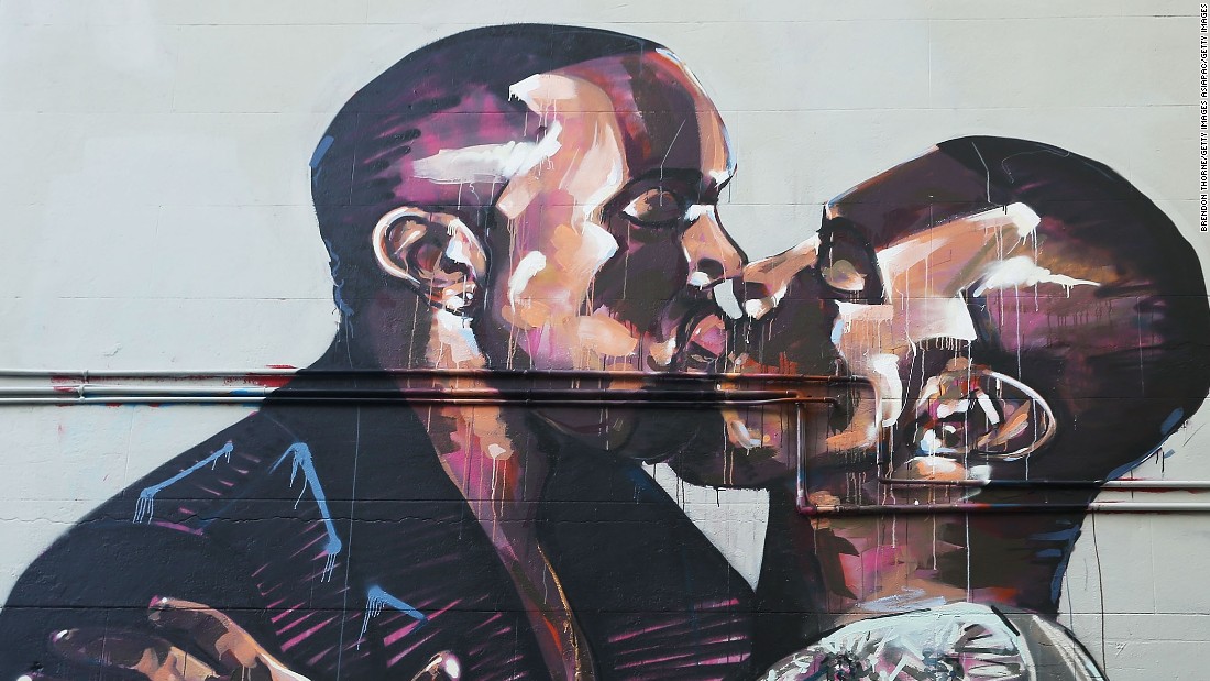 A mural showing hip-hop artist Kanye West kissing himself appeared in Sydney, Australia. The artist, Scott Marsh, was inspired by a photo of West kissing his wife, Kim Kardashian-West. 