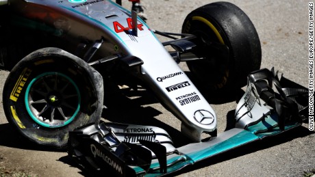 Lewis Hamilton&#39;s battered Mercedes lies at the side of the Circuit de Barcelona-Catalunya. 