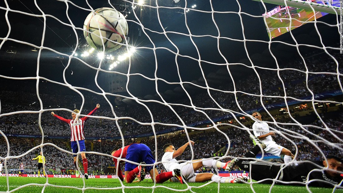 The ball hits the net as Atletico Madrid forward Yannick Carrasco scores the first goal during the UEFA Champions League final football match.