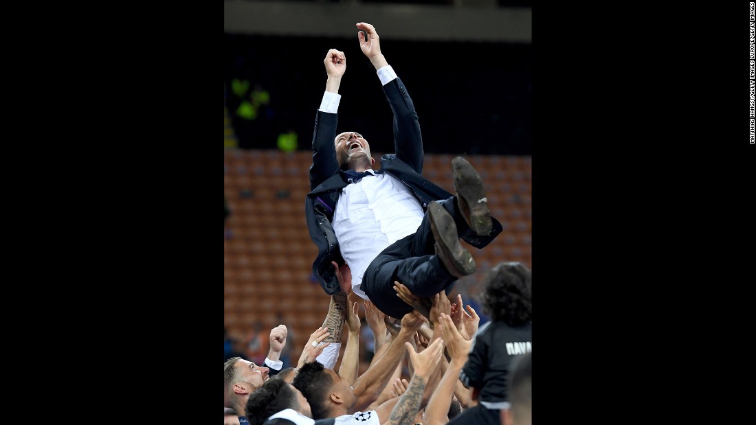 Real Madrid head coach Zidane is thrown in the air after the win.
