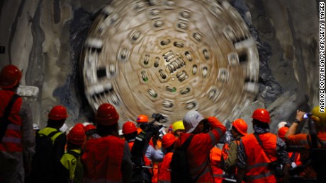 A giant drilling machine completes the tunnel beneath the Swiss Alps during a ceremony in October 2010.