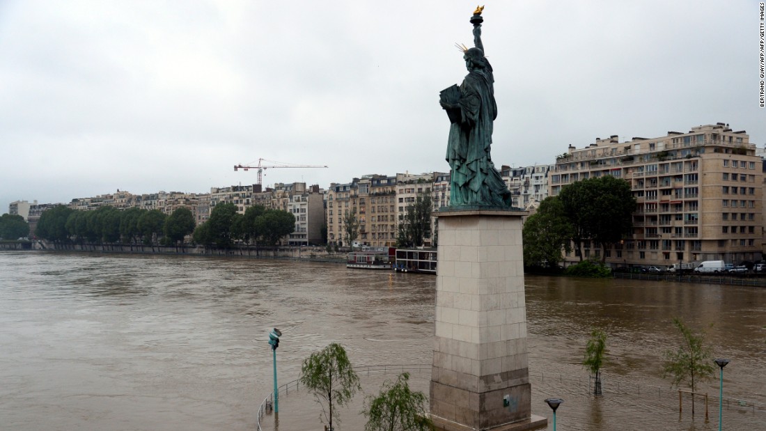 A replica of the Statue of Liberty faces the overflowing Seine in Paris on Wednesday, June 1.