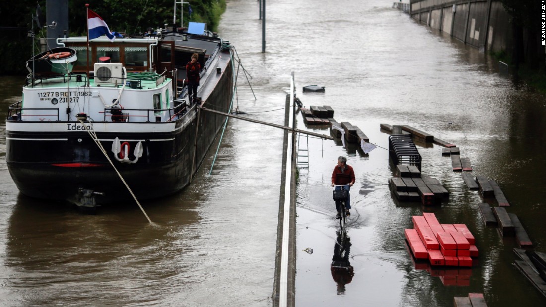 A man rides a bike through a Paris street flooded by the Seine on June 2. 