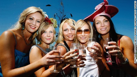 MELBOURNE, AUSTRALIA - NOVEMBER 01:  Race goes enjoy the atmosphere during The Melbourne Cup at Flemington Racecourse November 1, 2005 in Melbourne, Australia.  (Photo by Kristian Dowling/Getty Images)