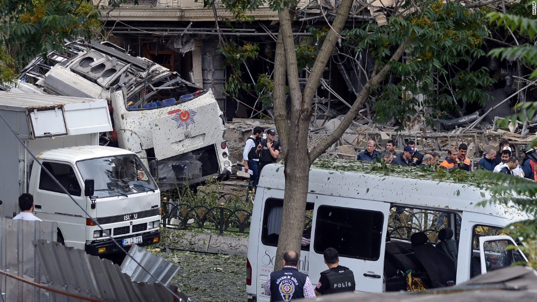 Police officers work at the scene of a car bombing in Istanbul on Tuesday, June 7. At least 11 people were killed and 36 were injured when a car bomb targeted a police bus, according to Turkey&#39;s state-run Anadolu agency.