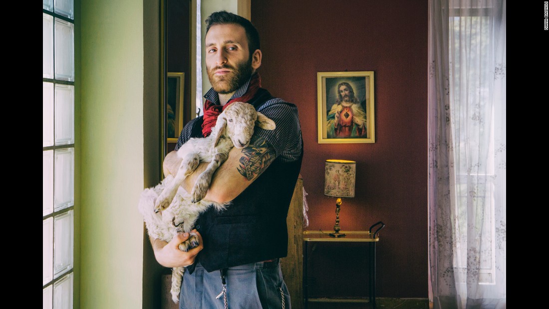 Ricky is an activist with Animal SOS, an animal sanctuary in northern Italy. He took in this lamb to avoid its slaughter during the Easter period. &quot;It surprises me to see how much feeling and intimacy can be between people and animals and how many people there are that really care,&quot; said Diana Bagnoli, who photographed Ricky as part of her &quot;Wild Love&quot; project.