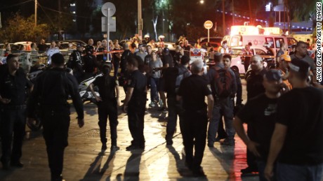 Israeli security forces, emergency personnel and civilians are seen at the site of a gun attack in the coastal city of Tel Aviv on June 8, 2016.  / AFP / JACK GUEZ        (Photo credit should read JACK GUEZ/AFP/Getty Images)