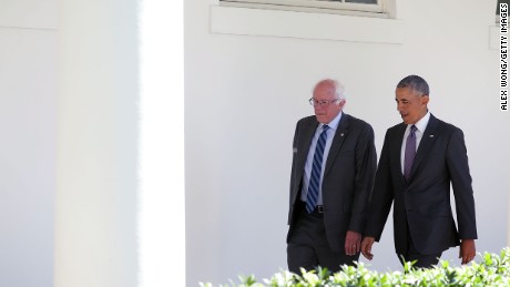 Democratic presidential candidate Sen. Bernie Sanders walks with President Barack Obama through the Colonnade as he arrives at the White House for an Oval Office meeting June 9, 2016 in Washington, DC. 