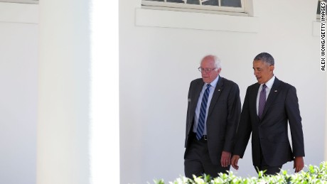 Democratic presidential candidate Sen. Bernie Sanders walks with President Barack Obama through the Colonnade as he arrives at the White House for an Oval Office meeting June 9, 2016 in Washington, DC. 