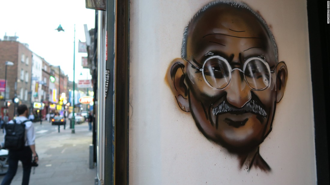 Indian hero Mahatma Gandhi is painted on the wall of a restaurant on Brick Lane.